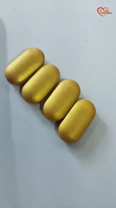 Close view of metallic gold coated caplets